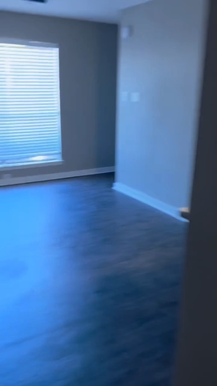 Walk through of a bedroom renovation with new drywall, paint, and flooring